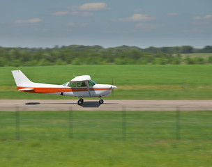 Fototapeta na wymiar Small plane takeoff