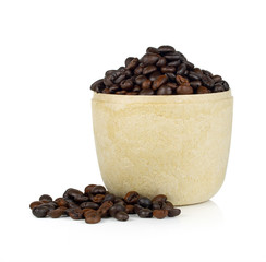 Paper cup of steaming coffee beans on white background
