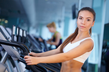 Fototapeta premium pretty girl training at the gym