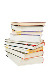 Pile of books with different colors of covers and white background