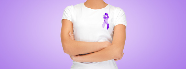 close up of woman with purple awareness ribbon