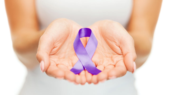 hands holding purple awareness ribbon