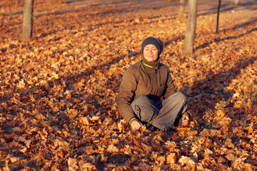 Girl with autumn leaves