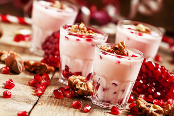 Homemade garnet yogurt with walnuts and pomegranate seeds, selec