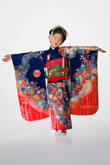Young Girl in Kimono on White