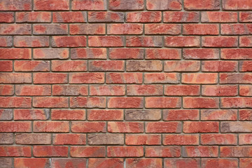 Orange brick wall. The example of brickwork as exterior wall facing.