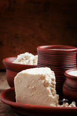 Homemade goat cheese in pottery in the country style, selective
