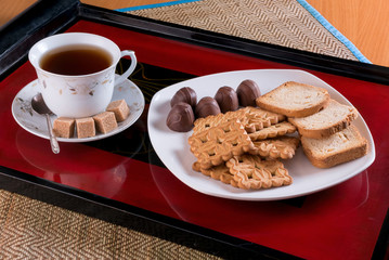 tea cookies, crackers and candies on a tray