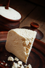 Homemade goat cheese in pottery in the country style, selective