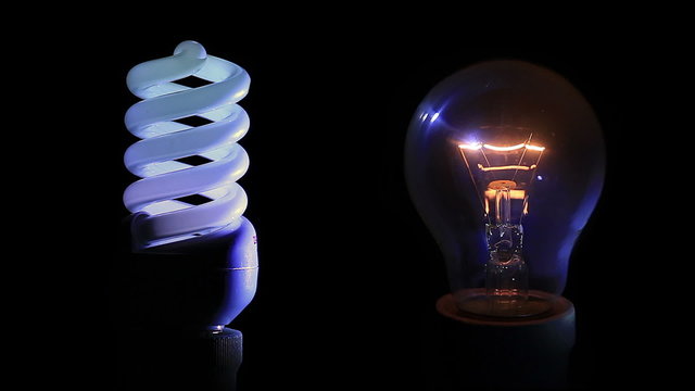 Traditional light bulb and energy saving light bulb