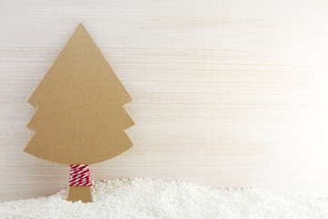 xmas tree paper craft on wood white backround