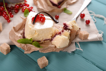 Tasty cheesecake with berries on table close up