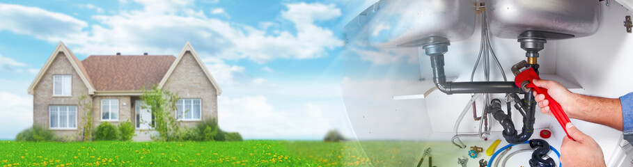 Hand of Plumber with a wrench.