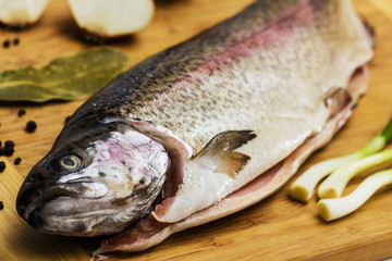Fresh Salmon trout with bay leaf, black pepper and onion isolated