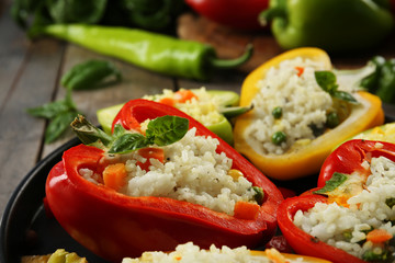 Stuffed peppers with vegetables on table close up