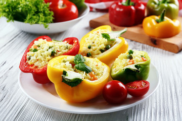 Stuffed peppers with vegetables on table close up
