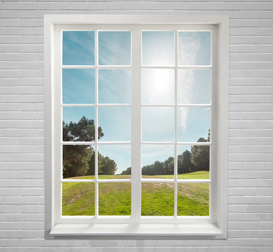 Fototapeta Modern residential window and trees and sky behind
