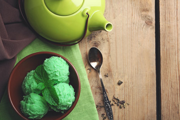 Homemade green tea ice-cream on wooden background