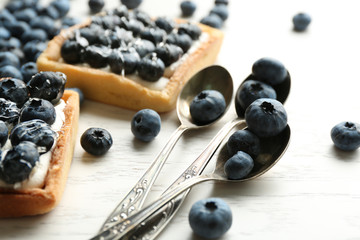 Gourmet fresh blueberry tarts on table