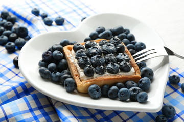 Gourmet fresh blueberry tart on plate, close up