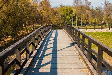     Wooden pedestrian bridge on Bundek lake in Zagreb, Croatia, in autumn 