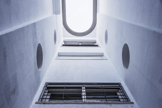 View from the couryard of a modern small building to the sky