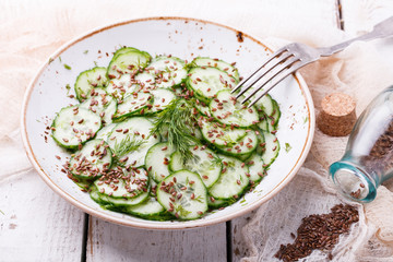   Cucumber salad with flax seeds.selective focus