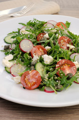 Salad with arugula and vegetables