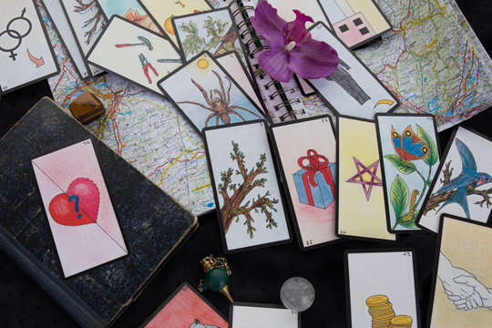 Esoteric table with card astrological wheel and magic pendulum tarots