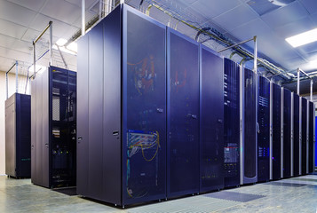 room with rows of server hardware in the data center