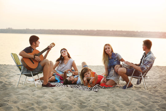 Carefree friends have fun on the beach