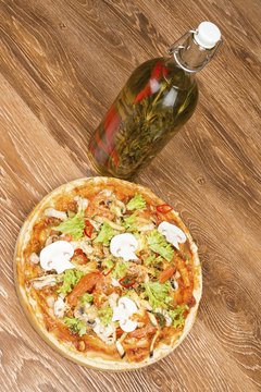 Pizza on dark wooden background. Stock image macro.