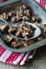 Roast sweet chestnuts in a metal spoon