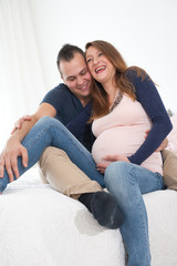 smiling pregnant couple