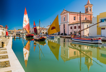 Reflection of church and boats on Canal Port