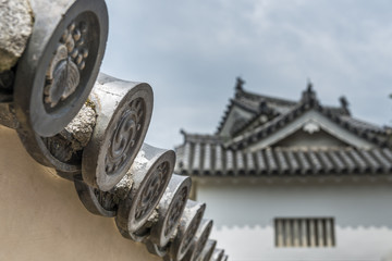 Ornate detailing on the end of the roof tiles at Himeji Castle i