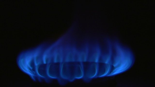 gas. burner gas stove. ignition gas stove burning match.