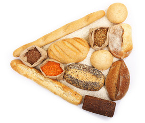 Composition of mixed breads and grains isolated on white background
