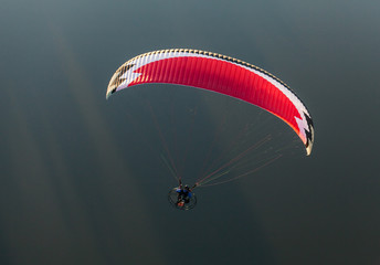 aerial view of paramotor flying over the river