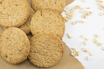 Integral cookies and wheat plant grains on a table
