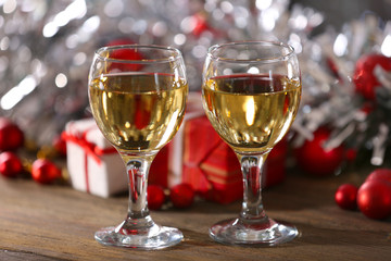 Champagne and Christmas decoration on bright background