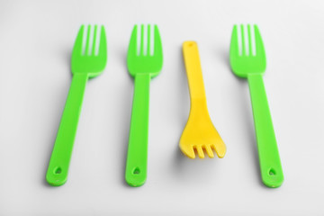 Disposable colourful forks isolated on white, Individuality concept