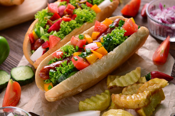 Hot dogs and vegetables on craft paper closeup