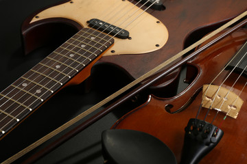 Fototapeta na wymiar Electric guitar and violin, close-up