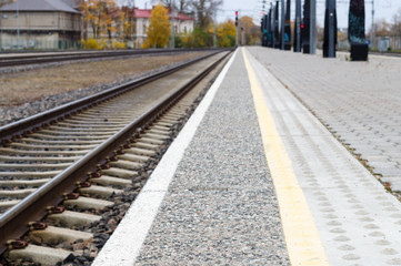 Fototapeta na wymiar Blurred image of railway track and rail platform
