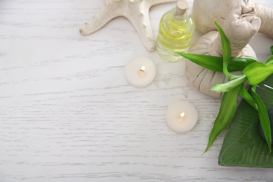 Beautiful composition of spa treatment on wooden table