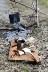 Grilled sausages on cutting board in the wood