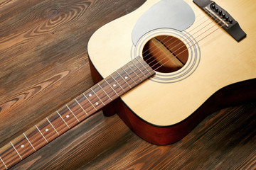 Guitar on wooden background