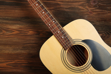 Fototapeta premium Guitar on wooden background