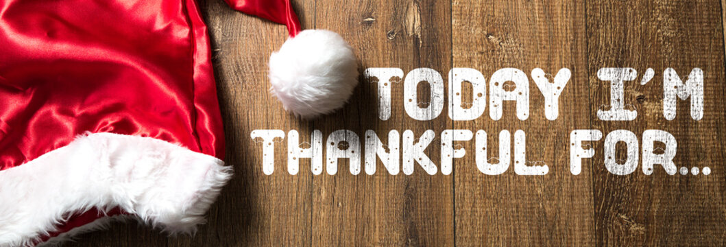 Today Im Thankful For... written on wooden background with Santa Hat